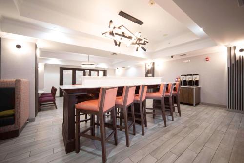 a dining room with a long table and chairs at Hampton Inn Bryant in Bryant