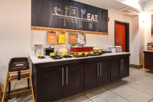 a kitchen with a counter with food on it at Hampton Inn Bryant in Bryant