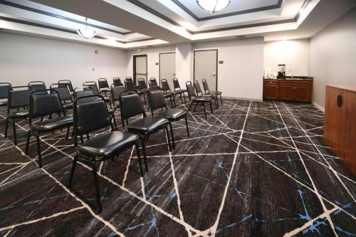 a conference room with chairs and a podium at Hampton Inn Bryant in Bryant