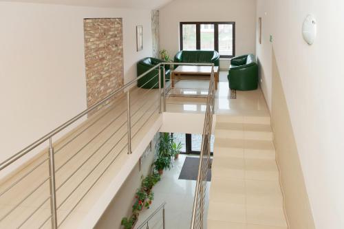 a staircase in a room with a stair case at Zajazd Beskidy in Żywiec