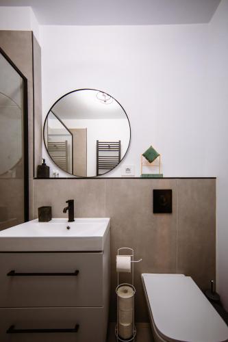 a bathroom with a sink and a mirror at Mountain View with Terrace in Sinaia