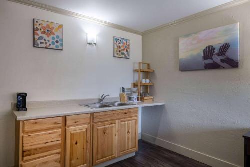 a kitchen with a sink and a counter at Travelodge by Wyndham Livingston in Livingston