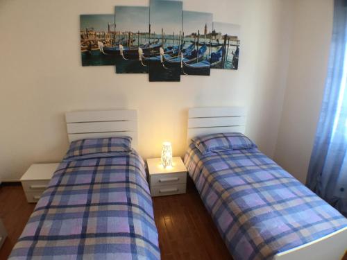 A bed or beds in a room at Appartamenti Giacomo Noventa
