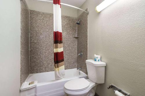 a small bathroom with a toilet and a shower at Baymont by Wyndham Socorro in Socorro