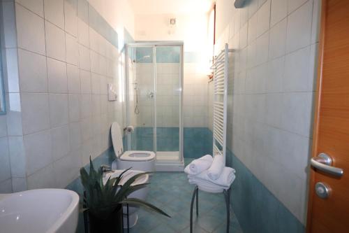 a bathroom with a shower and a toilet in it at Hotel Rio Umbertide in Umbertide