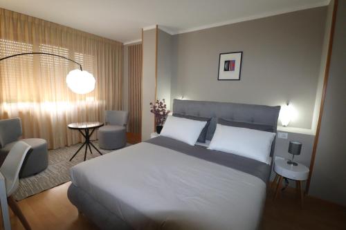 Postel nebo postele na pokoji v ubytování Hotel Rio Umbertide