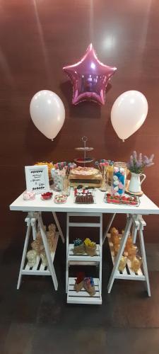 a table with a bunch of different types of food at Hotel Las Moreras in León