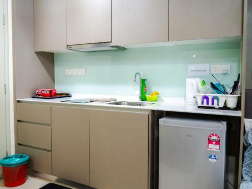 a kitchen with a sink and a counter top at Tamarind Suites or D'Pulze Residence or Domain NeoCyber, click Room selection for location and pics in Cyberjaya