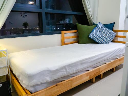 a bed in a room with a window at Tamarind Suites or D'Pulze Residence or Domain NeoCyber, click Room selection for location and pics in Cyberjaya
