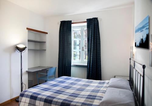 Postel nebo postele na pokoji v ubytování CASA NELLE LANGHE