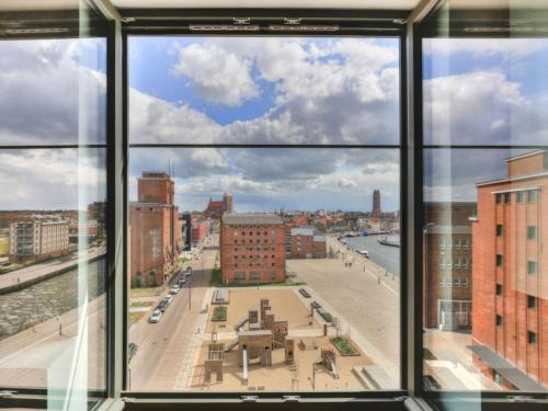 a view of a city from a window at Ohlerich Speicher App_ 36 in Wismar