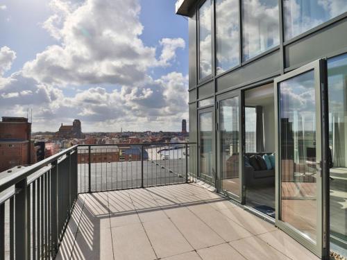 a balcony with a view of a city at Ohlerich Speicher App_ 47 in Wismar