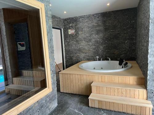 a bathroom with a bath tub and a sink at Camelia 2 Beautiful 1+1 on Cleopatra in Alanya