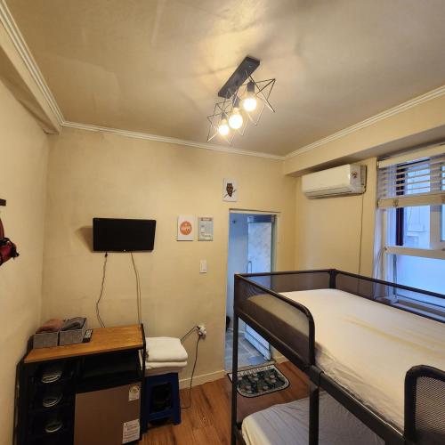 Кровать или кровати в номере Joy Guesthouse