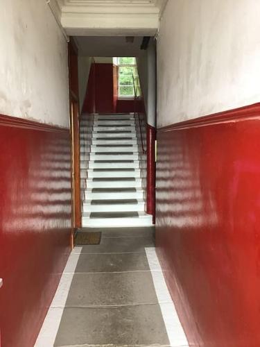 an empty hallway with stairs in a building at Bellevue Bute, Luxury 2 bedroom sea view flat in Rothesay