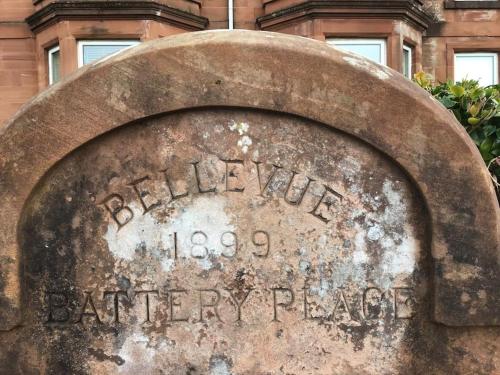 a sign in front of an old building at Bellevue Bute, Luxury 2 bedroom sea view flat in Rothesay