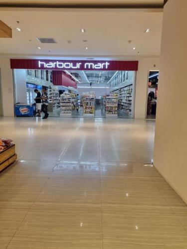 a shopping mall with a tuchouk net sign in the middle at HarbourBay Residence. Batam. Studio. 1min to Ferry in Jodoh