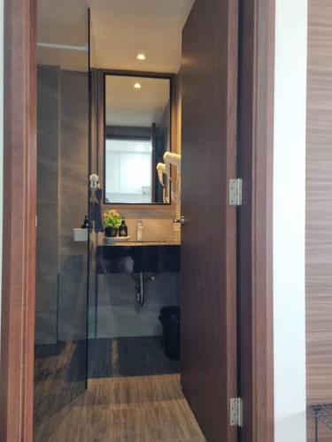 a bathroom with a sink and a mirror at HarbourBay Residence. Batam. Studio. 1min to Ferry in Jodoh