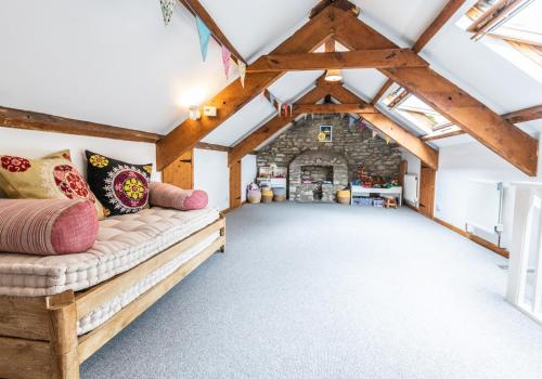 a room with a couch in the middle of a building at Panteg - a gorgeous retreat near the coast for 10 in Cardigan