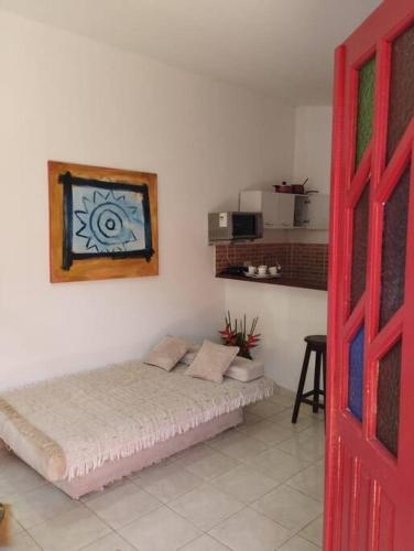 a bedroom with a bed in a room at Casa na Praia de itacimirim Vila Maria in Camacari