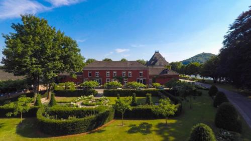 an aerial view of a house with a garden at Landgoed Kasteel de Hoogenweerth in Maastricht