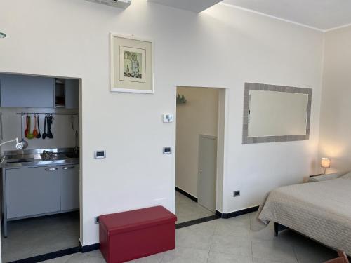 Ένα ή περισσότερα κρεβάτια σε δωμάτιο στο la casetta del marinaio - the sailor's cottage