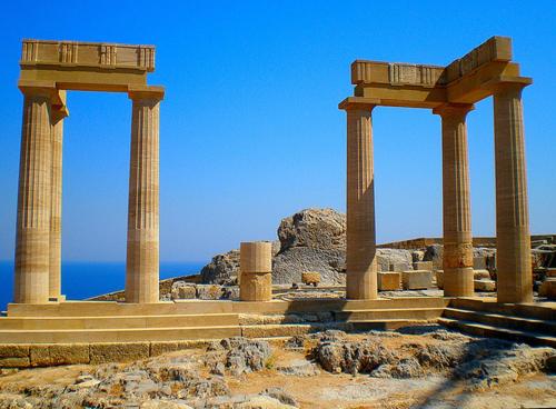 two stone pillars in front of the ocean at Mediterranean Hotel in Rhodes Town