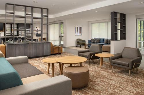 a lobby with couches and chairs and tables at SpringHill Suites by Marriott Cincinnati Mason in Mason