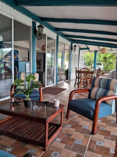a living room with chairs and a coffee table at Hostel SaltWater in San Juan del Sur