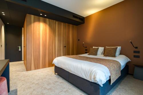 Postel nebo postele na pokoji v ubytování Aux Etangs - Hôtel