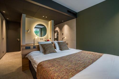 Postel nebo postele na pokoji v ubytování Aux Etangs - Hôtel
