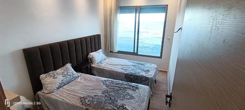 Katil atau katil-katil dalam bilik di Appartement Ilyas