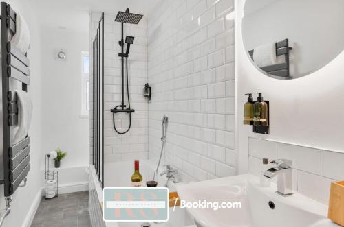 a white bathroom with a sink and a mirror at Contractors Accommodation South Wales By Rutland Stays Short Lets & Serviced Accommodation Pentre in Treorky