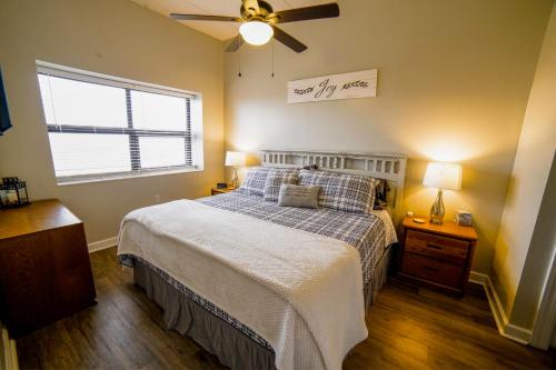 a bedroom with a bed and a ceiling fan at Altitude Adjustment atop Sugar Mountain at Sugar Top in Sugar Mountain