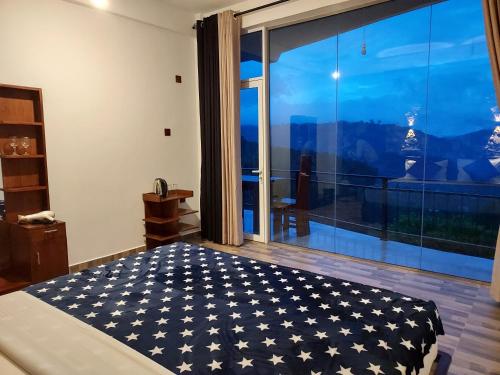 a bedroom with an american flag bed in front of a window at Nine Arch Gap in Ella