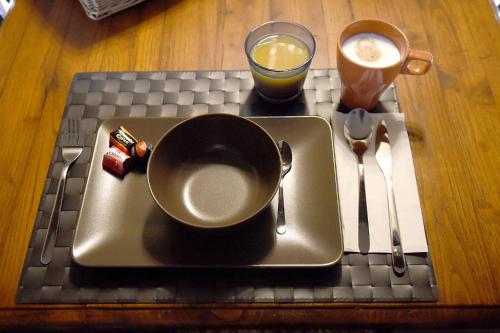 a tray with a cup of coffee on a table at San Francesco Suite in Poggio Bustone
