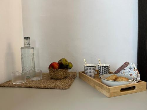 a table with two trays of food and a bottle of water at Hotel San Miguel Menorca in Mahón