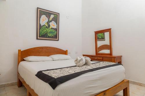 Postel nebo postele na pokoji v ubytování Hotel Las Palmas Cancun Centro