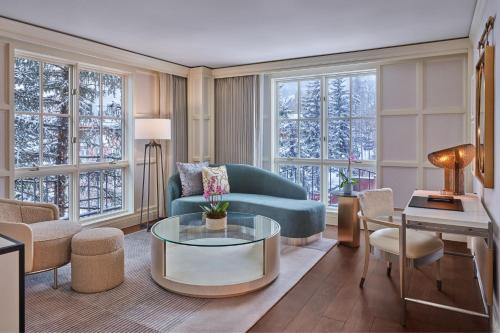 a living room with a couch and a table at St. Regis Aspen Resort in Aspen