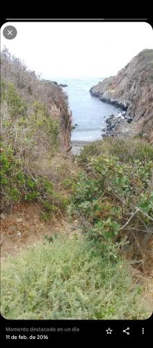 a view of a beach with the ocean in the background at Septiembre se pasa mejor en los Molles, te esperamos en cabaña5 in Los Molles