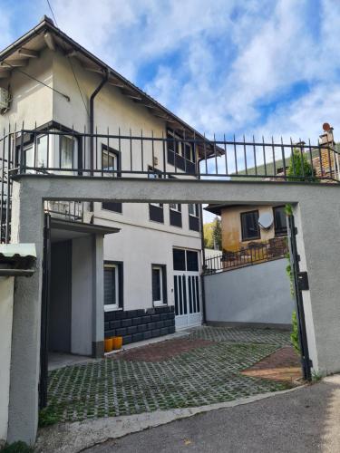 a house with a balcony on top of it at VILA COMO EN CASA - FREE PARKING in Sarajevo