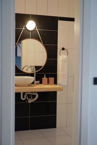 a bathroom with a sink and a mirror at Lb Boutique Hotel in Kumluca