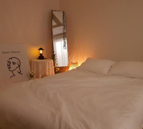 Llit o llits en una habitació de Merry Greentea #year-end home party renewal #Jeju island mood #Cozy home #Photo spot