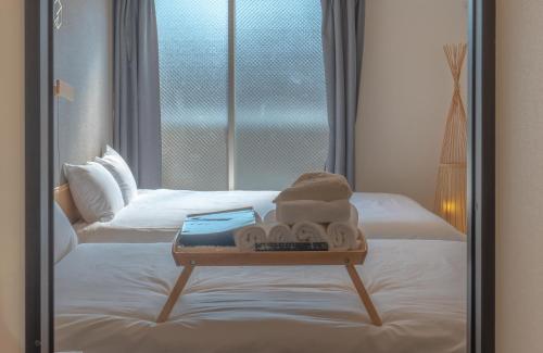 INA HOUSE Nijojoにあるベッド