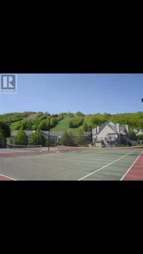 a view of a tennis court with a tennis racket at Blue Mountain Escape, WIFI, Base of North lift in Blue Mountains