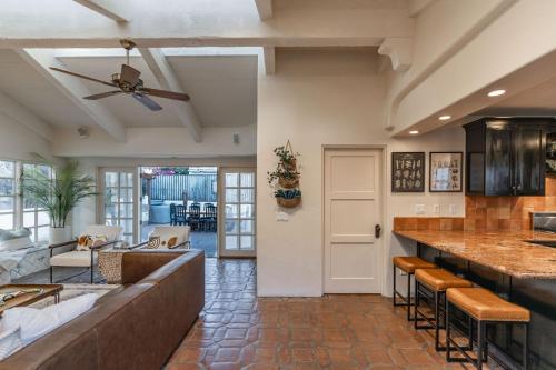 a kitchen with a bar and a living room at Ocean View Spanish Beauty Half Block to Beach in San Diego