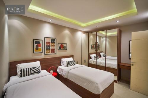 Prime Residence New Cairoにあるベッド