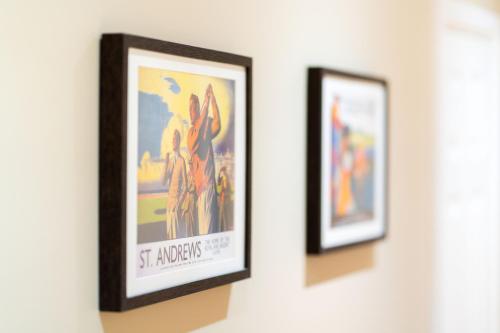 two framed pictures hanging on a wall at Strathallan - Luxury 3 Bedroom Apartment, Gleneagles, Auchterarder in Auchterarder