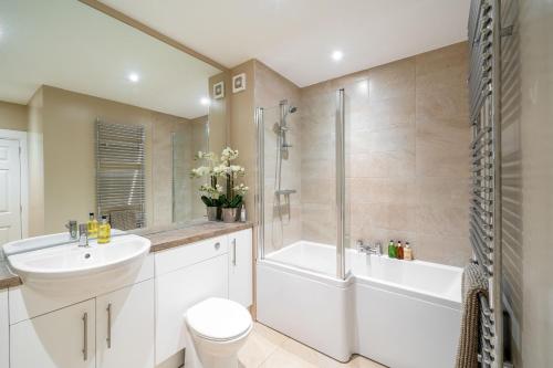 a bathroom with a sink toilet and a shower at Strathallan - Luxury 3 Bedroom Apartment, Gleneagles, Auchterarder in Auchterarder