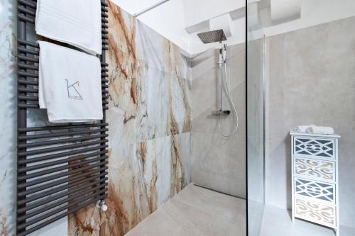 a bathroom with a shower with a glass door at Kalinifta - Lecce Selection in Lecce